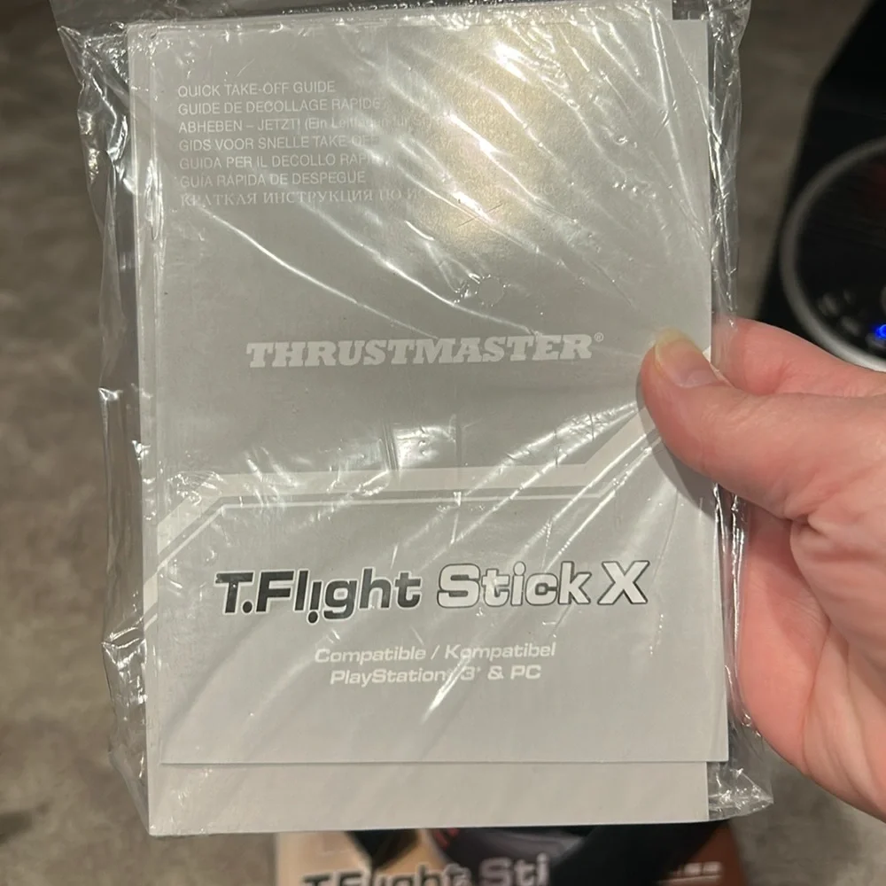 This is a T Flight Stick X. It comes in its original box with 2 additional discs